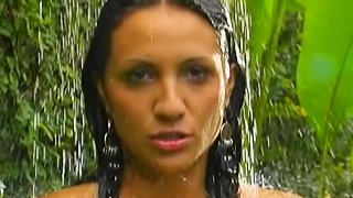 Hot babe by the water fall enjoys finger fucking masturbation