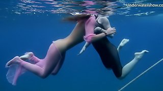 Two sexy babes strip down while diving in the ocean