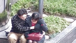 Cute Japanese chick gets her chest fondled at a public park