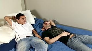 Sexy gay guy with short dark hair playing with his boyfriend's big cock